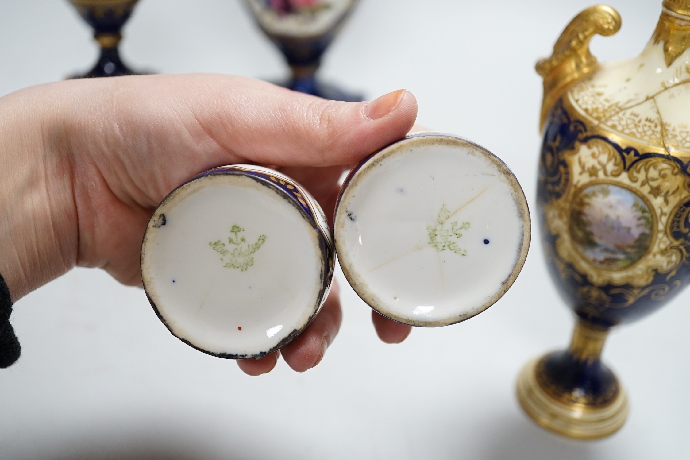 A two-handled pedestal Coalport vase, together with two other vases and a pair of posy vases. Tallest 22cm